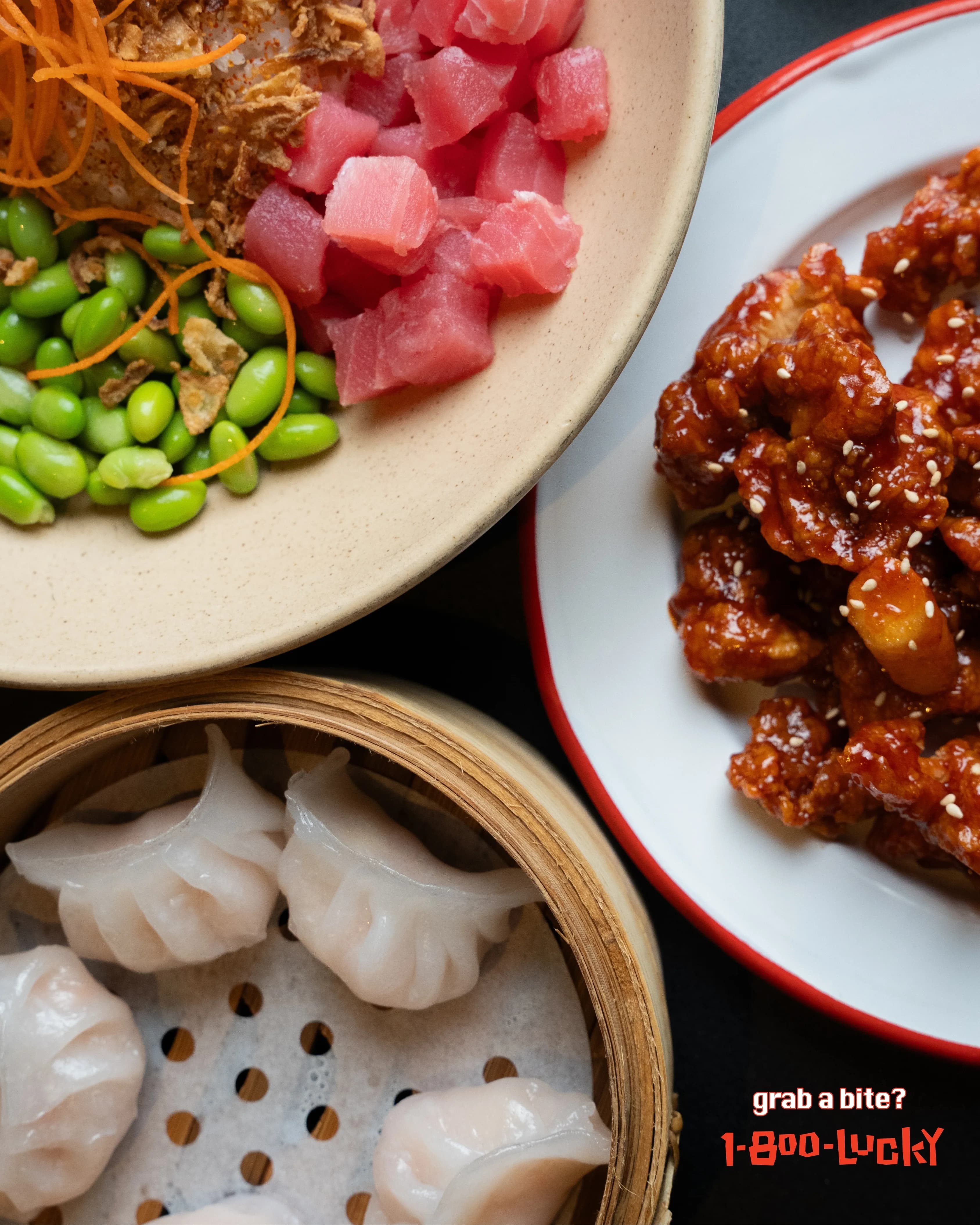 A 1-800-Lucky 'grab a bite?' promo — an overhead spread of shrimp dumplings in a bamboo steamer, a tuna poke bowl with edamame, and sesame orange chicken.