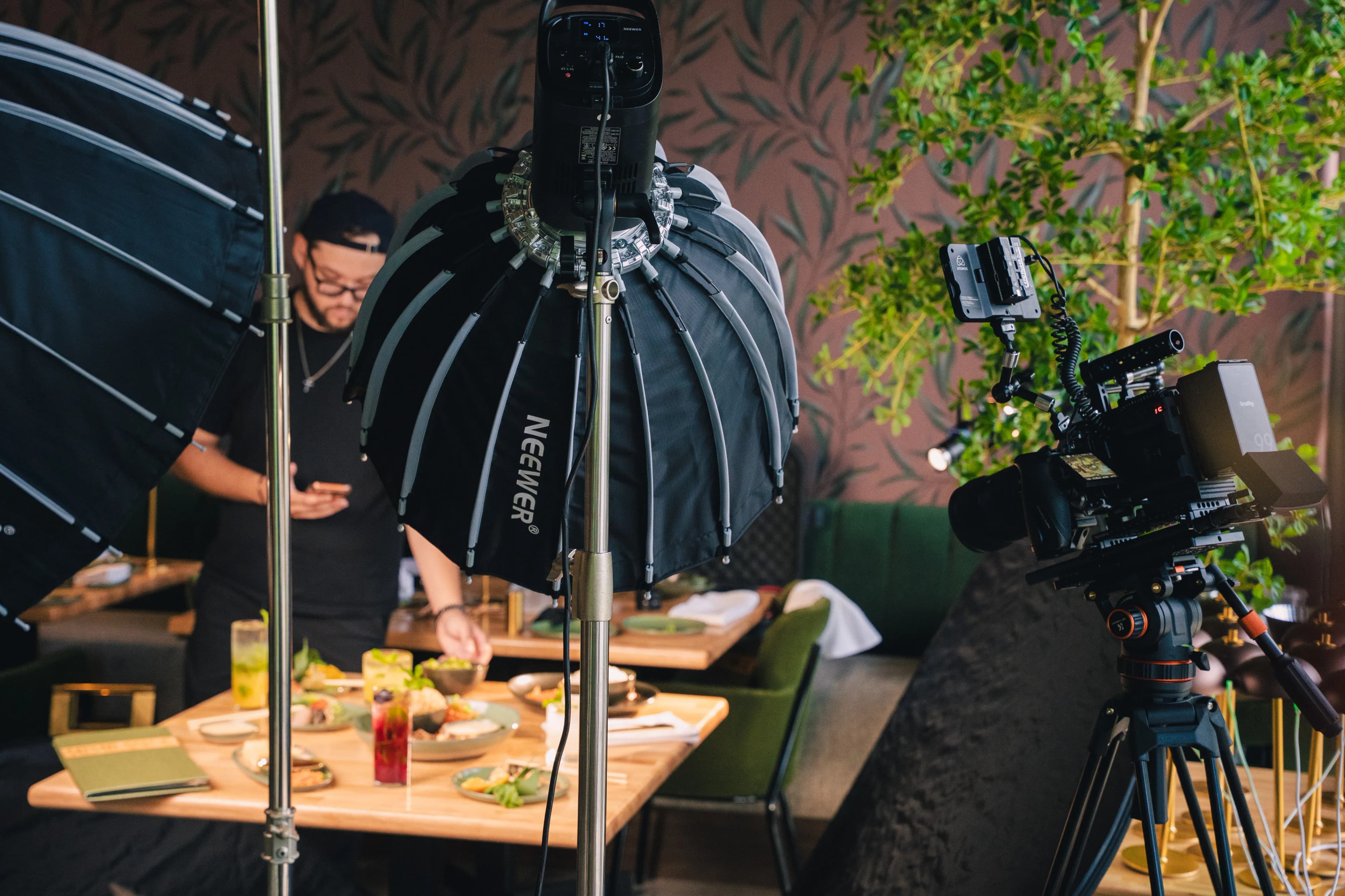 Behind the scenes — crew film a Sushi Sake table under a softbox at night.